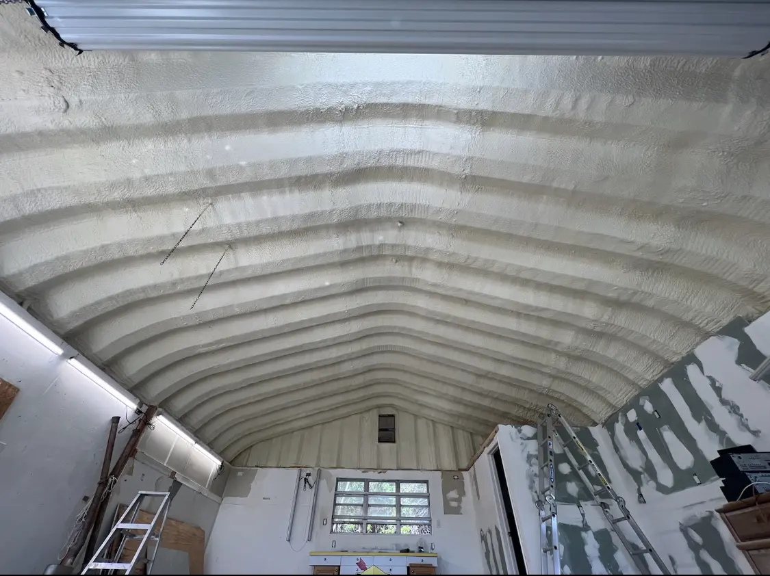 Spray polyurethane foam applied to the underside of a metal roof deck in Streamwood